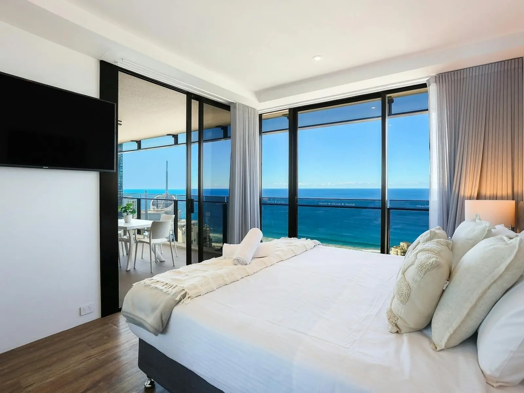 Circle on Cavill Surfers Paradise, bedroom with a sliding door access to balcony, view of the ocean