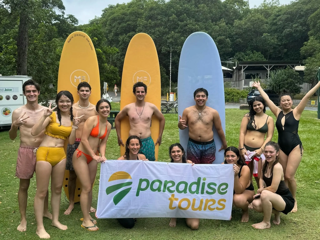 Group Photo with Paradise Tours Banner - North Stradbroke Island