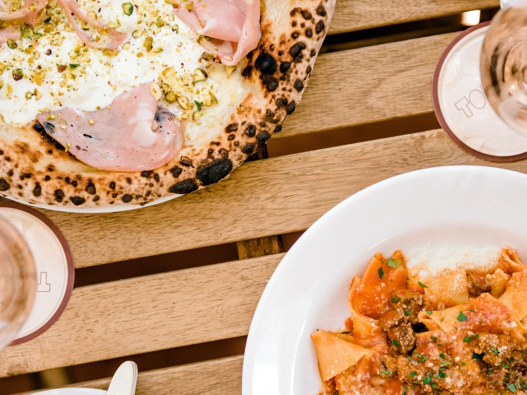 Woodfire Pizza and Pasta on wooden table