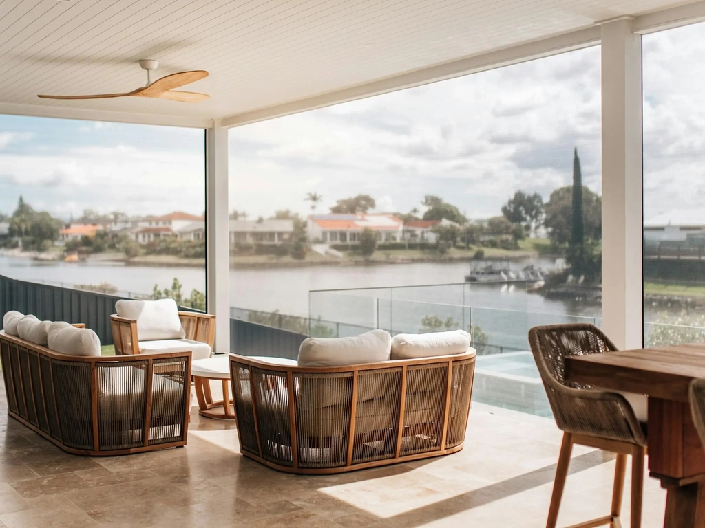 Covered outdoor dining area overlooking a canal