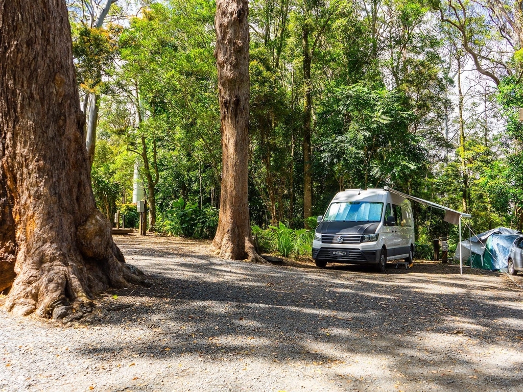 an image of a van parked on a drive on powered campsite