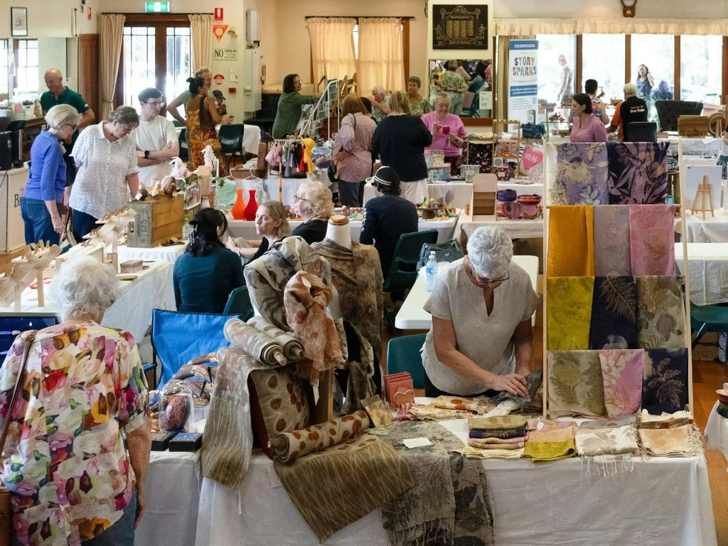 busy village craft market scene in Mudgeeraba