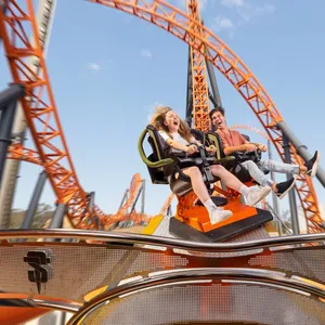 Two guests enjoying Steel Taipan's Spinning Seats