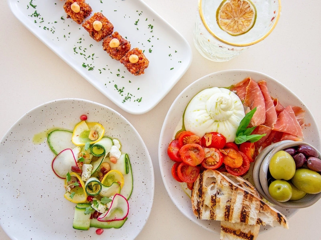 Burrata, olives, selection of meats with sides