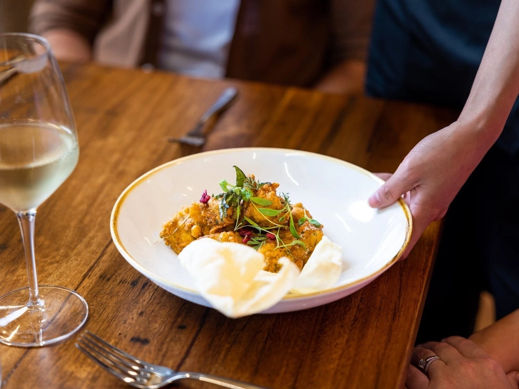 Plated food being served