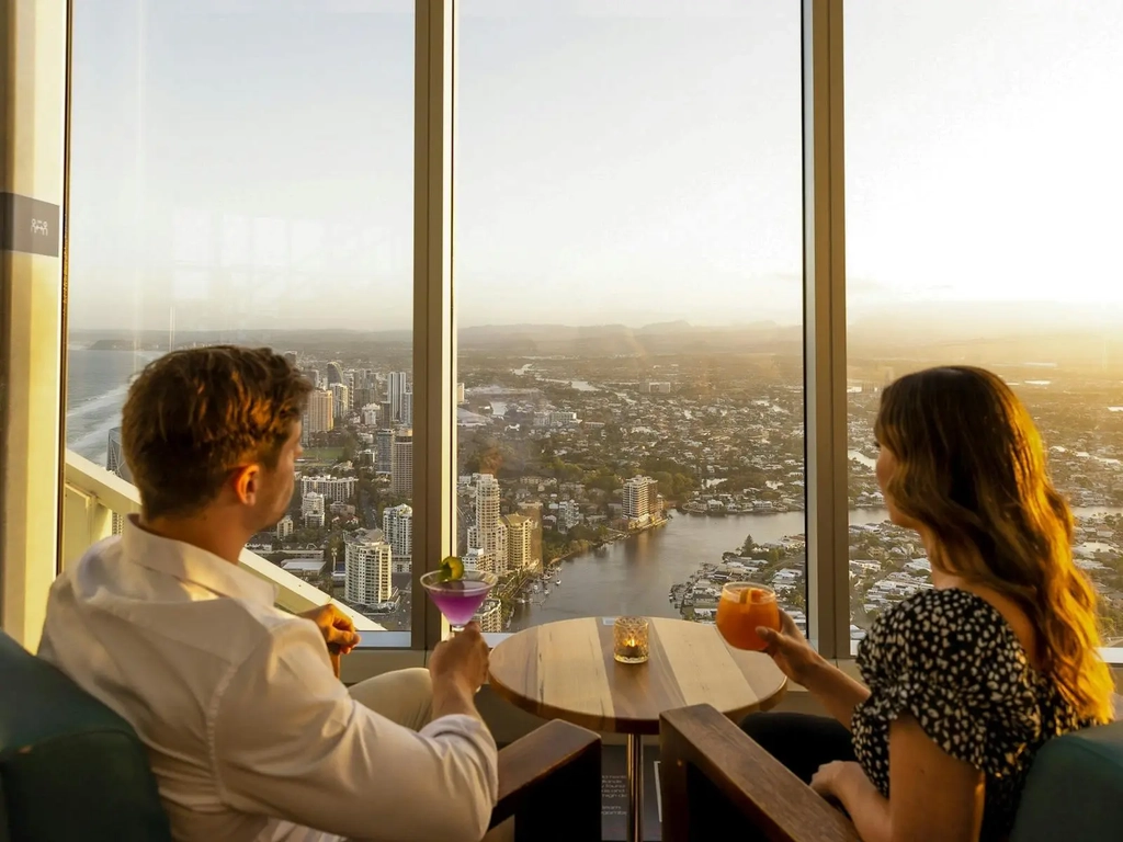 couple look at view with drinks