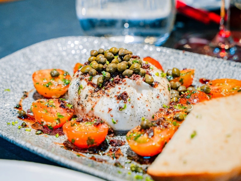 Burrata with cherry tomatoes and capers