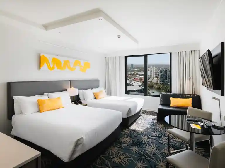 Superior twin bed with river and hinterland views