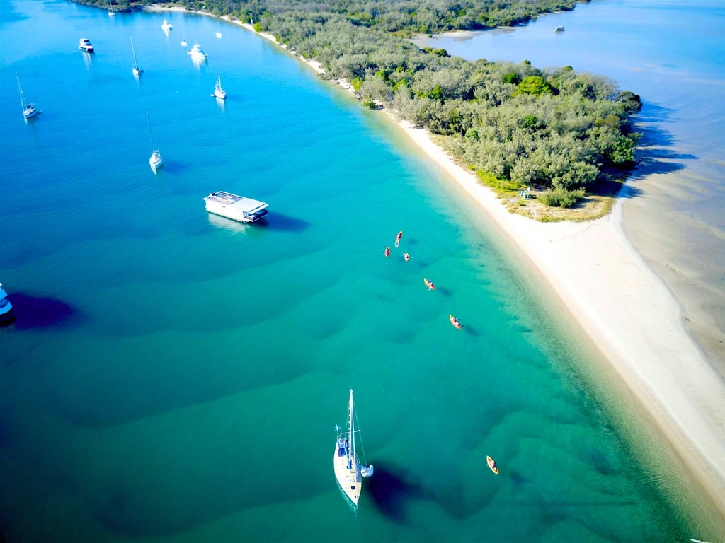 Kayaking though the crystal waters of Wave break Island, Gold Coast