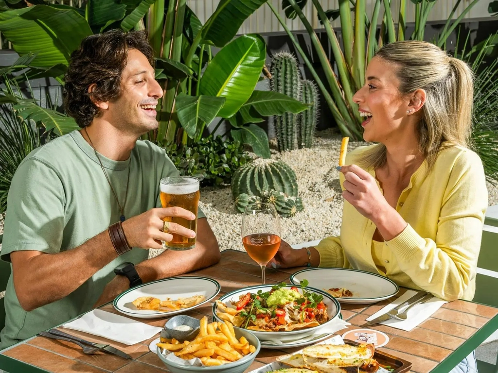 Customers in the beer garden enjoying a meal