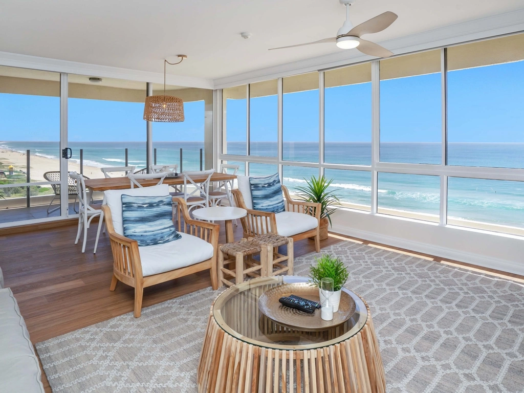 Open plan living room with beachfront views