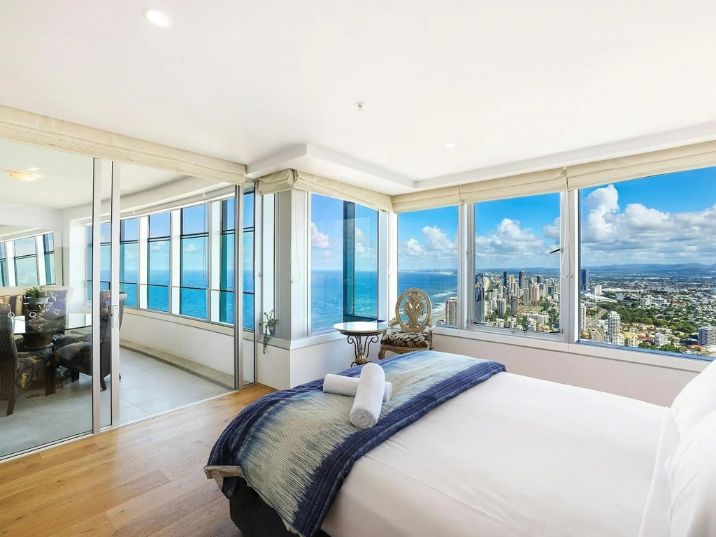 Q1 Resort Surfers Paradise, bedroom with city and ocean views, indoor balcony access from bedroom.