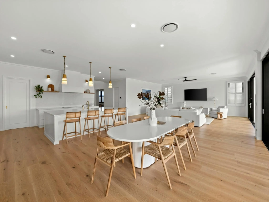 Open plan living and dining room with timber floors
