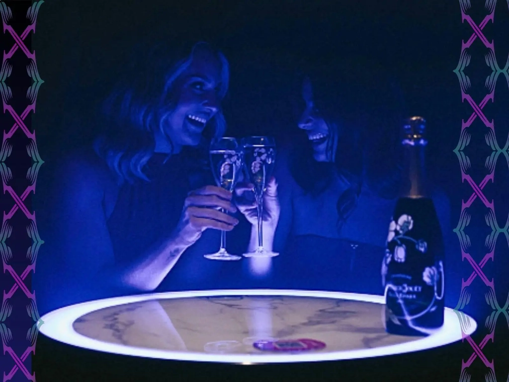 Guests enjoying a VIP table experience with champagne at X Nightlife, Broadbeach