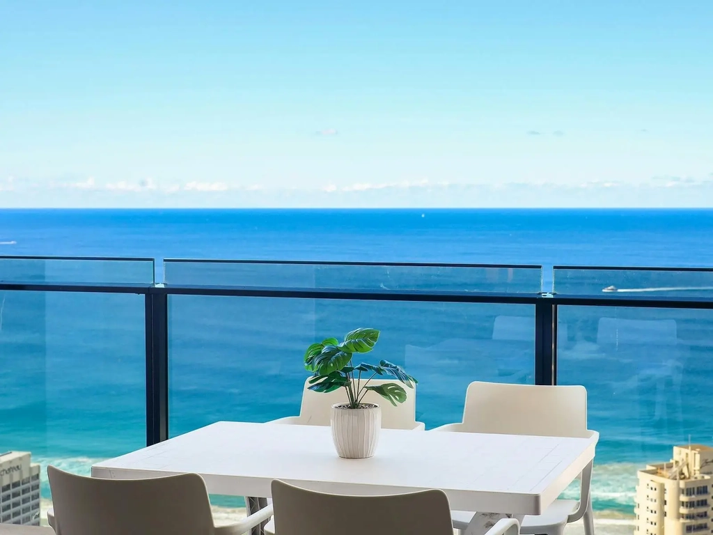 Circle on Cavill Apartment Surfers Paradise - Balcony with outdoor table and chairs and ocean views