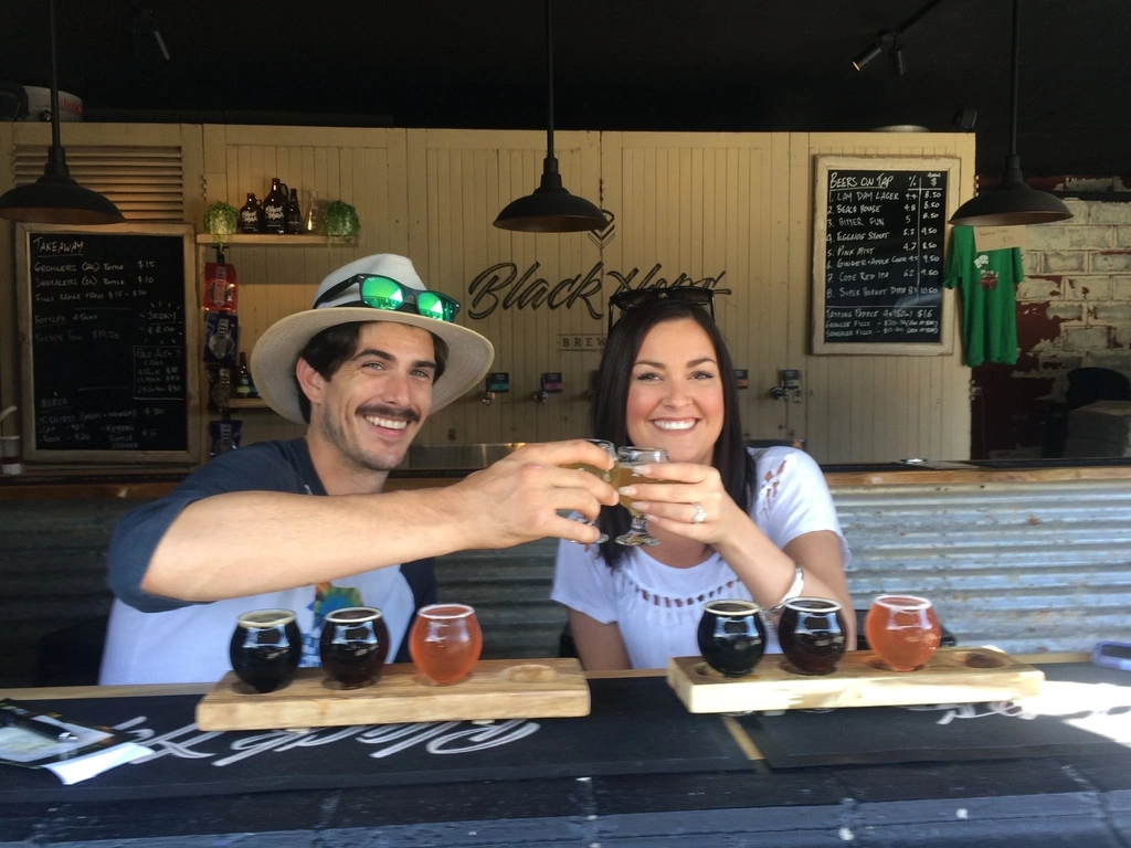 A couple enjoying beers at Black Hops