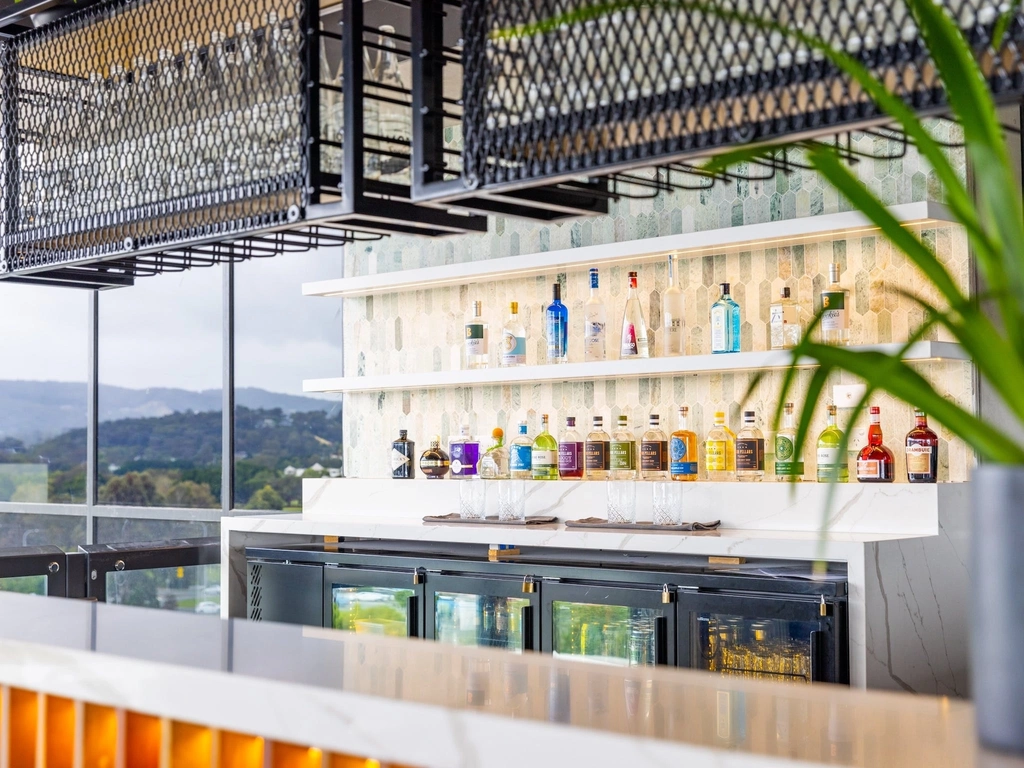 Bar with drinks and glasses with a hinterland view
