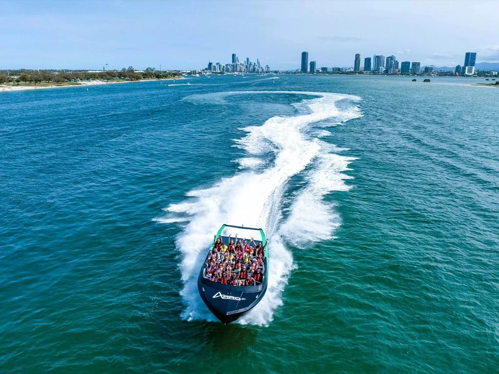 Aerial view of Arro Jet Boat with buildings in the background.