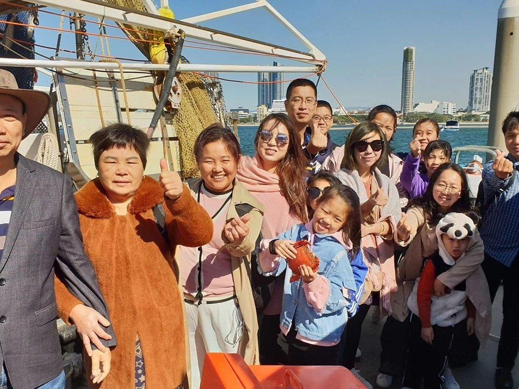 guests on boat smiling