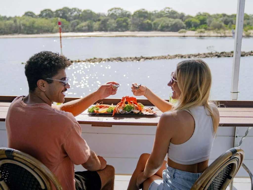 Couple with seafood on river cruise