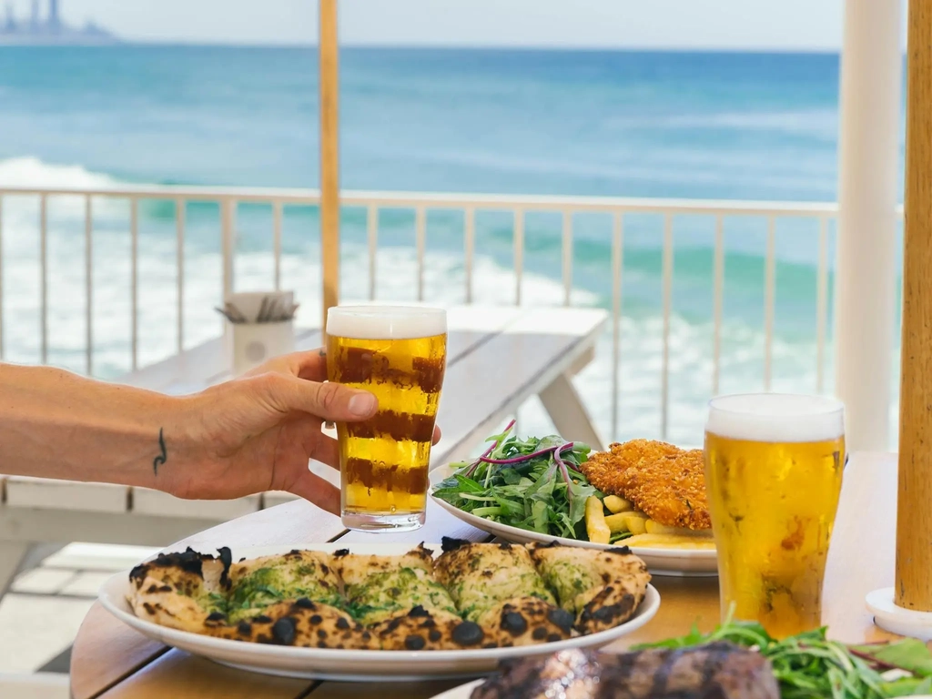 Lunch and cold beers on the Beach Deck at Burleigh Pavilion overlooking the ocean.