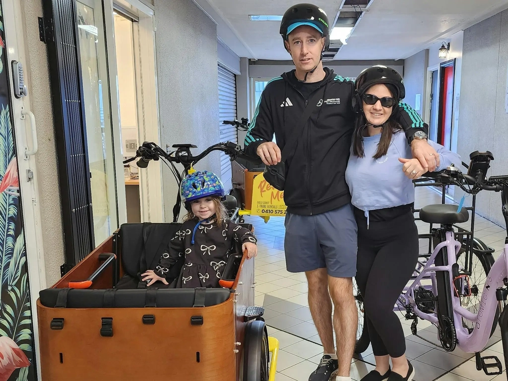 Family picking up E-Trike rentals in Broadbeach —  the family cargo and street style E-Trike