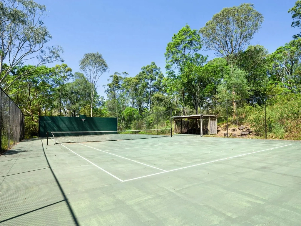 Enjoy a friendly game of tennis in the fresh air, surrounded by beautiful natural scenery.