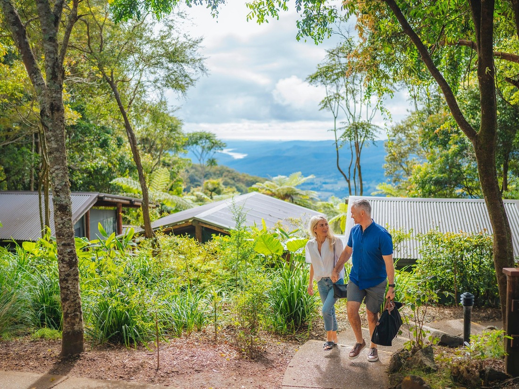 An image of a couple exploring the Binna Burra Campsite