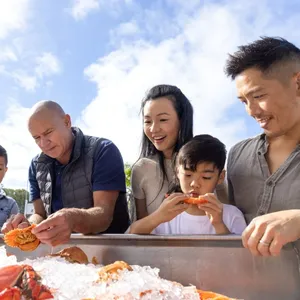 guests looking at seafood on ice