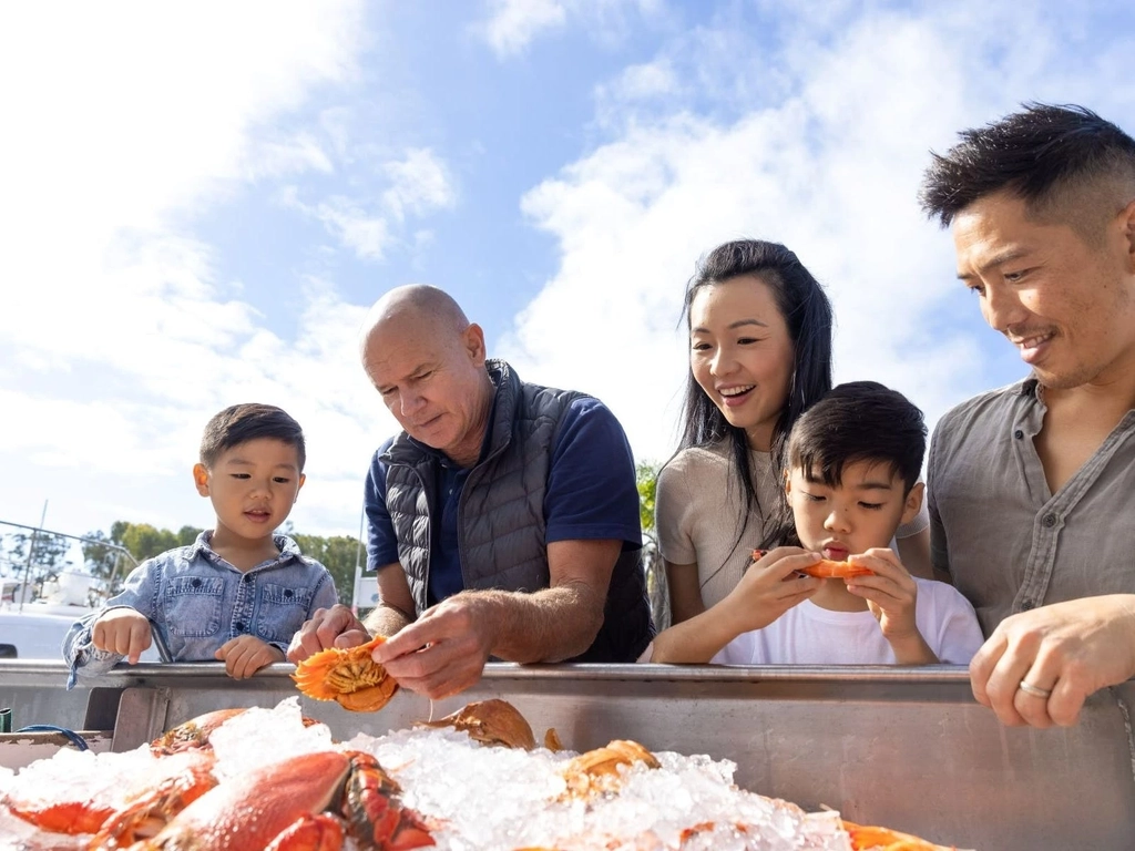 guests looking at seafood on ice