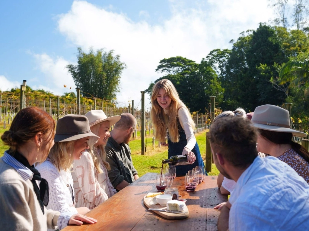 guests outside at table being poured wine