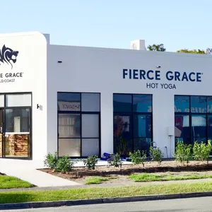 Studio Exterior Shot. Grey building with Fierce Grace branding