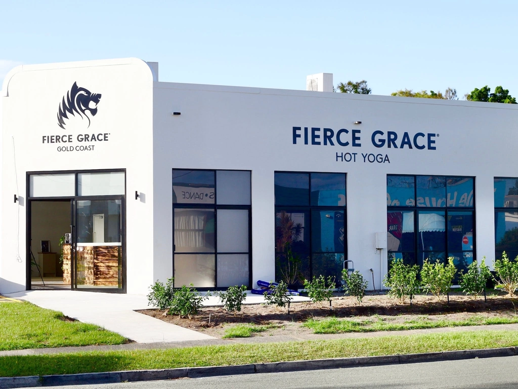 Studio Exterior Shot. Grey building with Fierce Grace branding