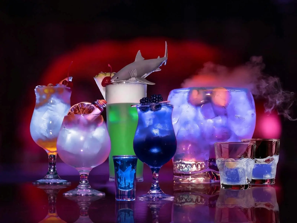 A photo of a collection of Dracula's cocktails on the bar top.