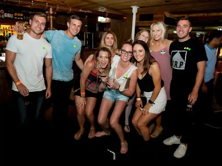 Fun group of girls and guys on pub crawl in surfers paradise