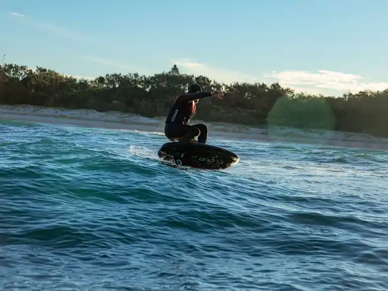 A person Foiling on waves on gold coast Australia Queensland with Foiling Australia