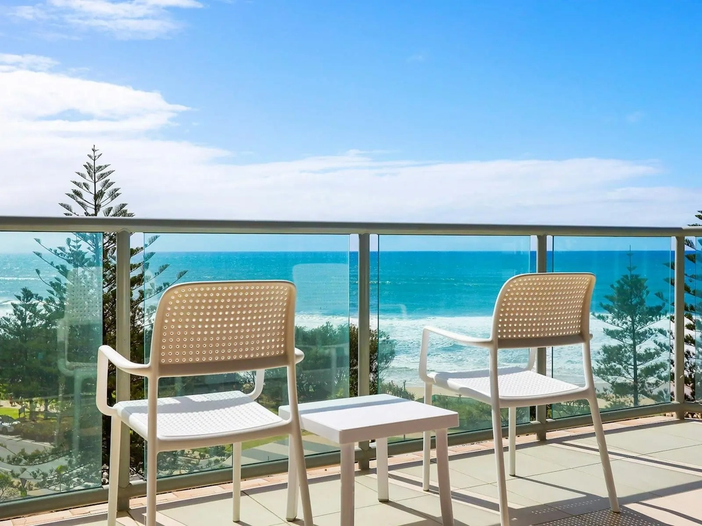 Peninsula Apartments Surfers Paradise , ocean view from the balcony  2 chairs and a coffee table