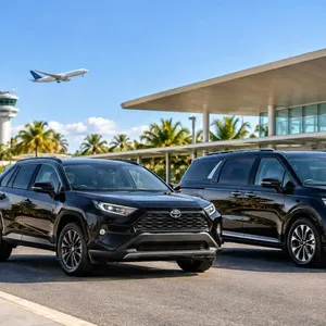 Black Toyota RAV4 and Kia Carnival representing CGC Airport Transfers on the Gold Coast, Queensland.