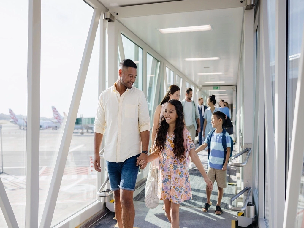 Passengers walking along Gold Coast Airports  aerobridge