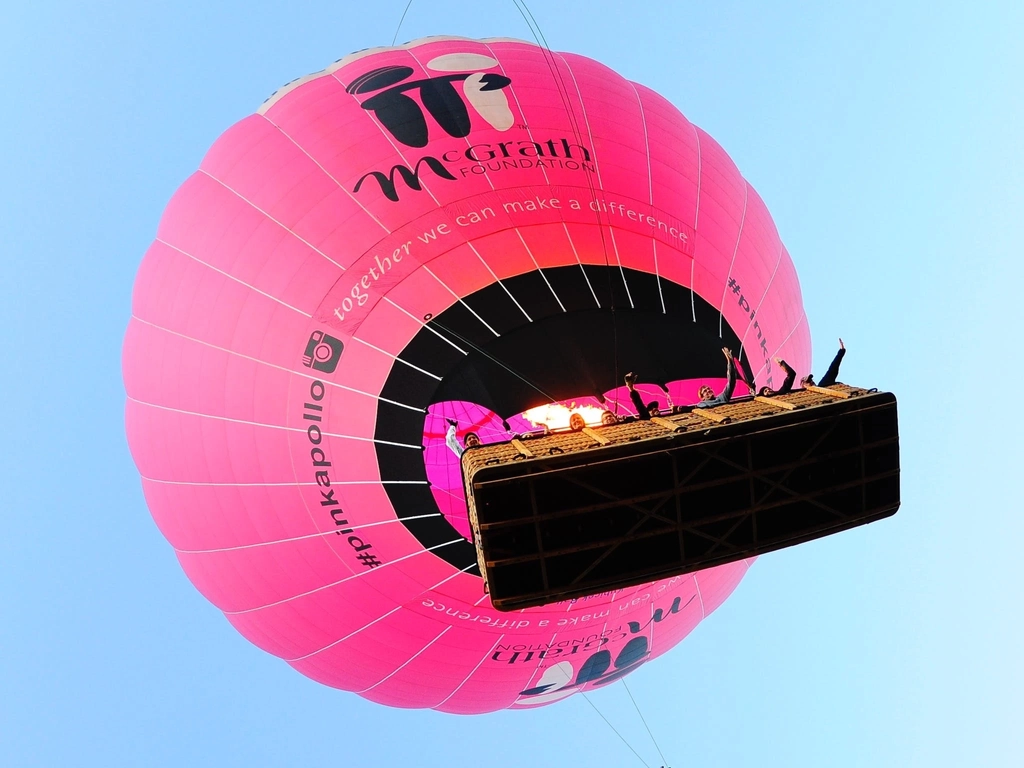 Going UP! Giant Pink Hot Air Balloon Rising into the Air with McGrath Foundation Logo