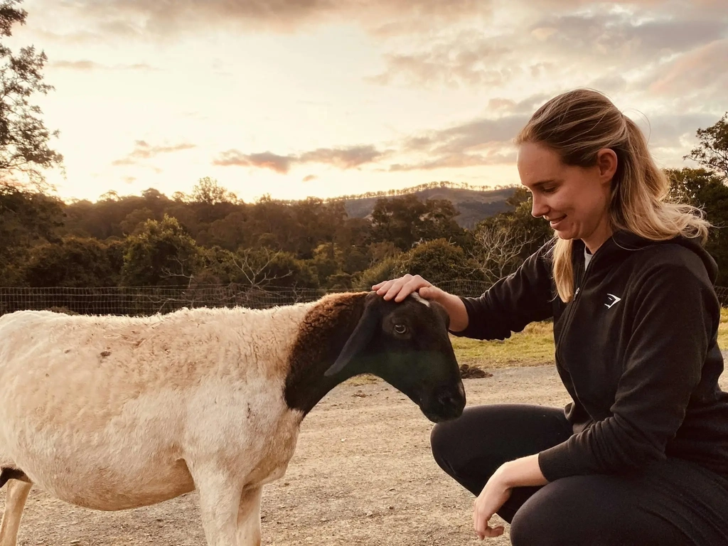 Guest interacting with the farm animals at Country Mile Escape