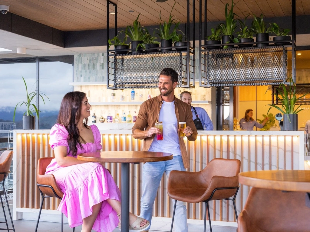 Couple enjoying drinks at the bar area