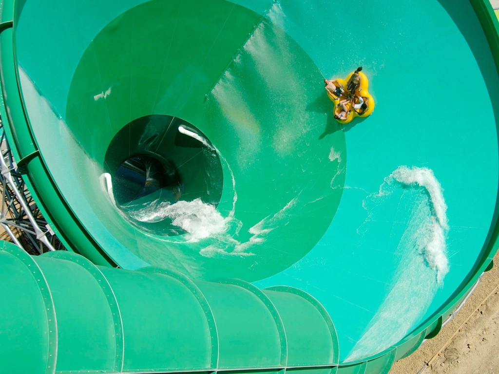 Group of guests on tube sliding on The Green Room water slide