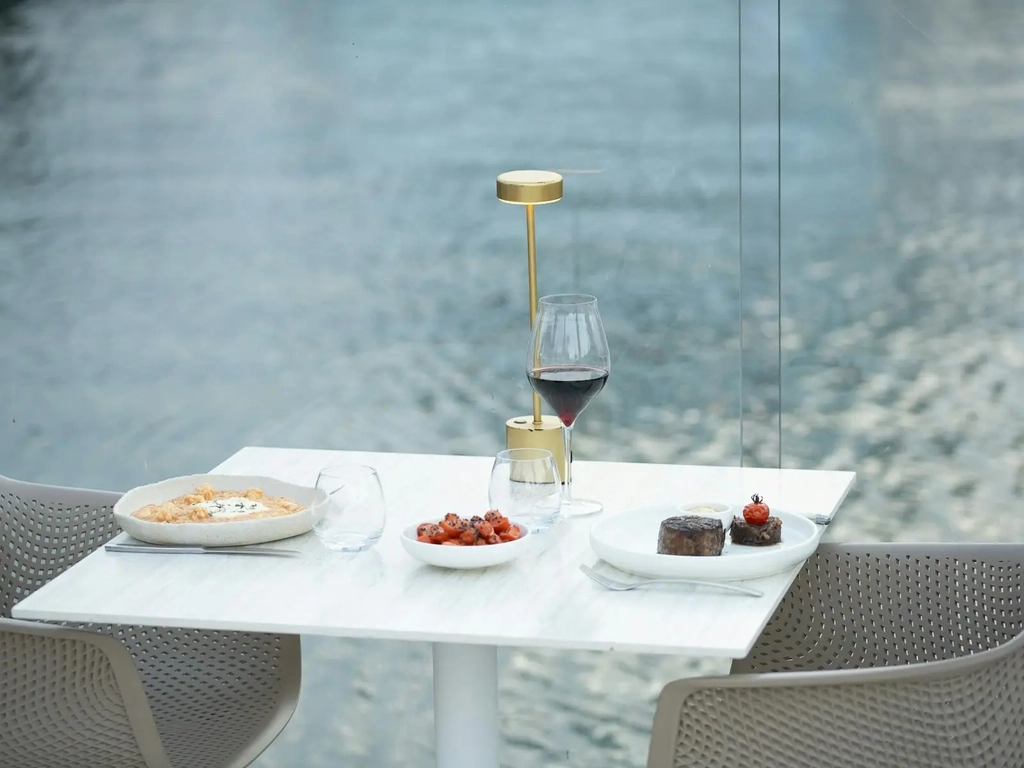 Waterfront restaurant setting at MĀRE on the Gold Coast