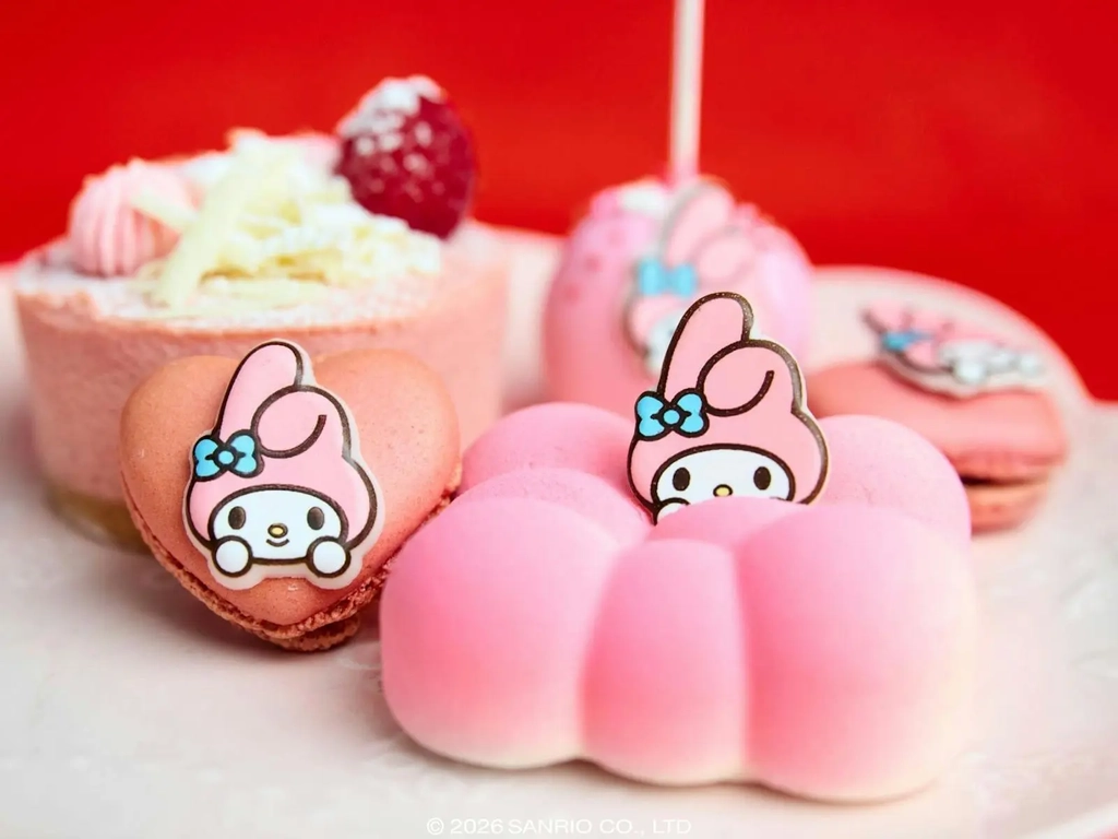 Pink My Melody themed desserts including a macaron and a cloud-shaped pastry.