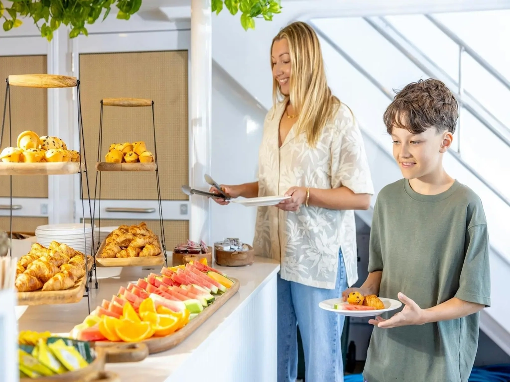 Guests enjoying a delicious morning tea of pastries and tea and coffee