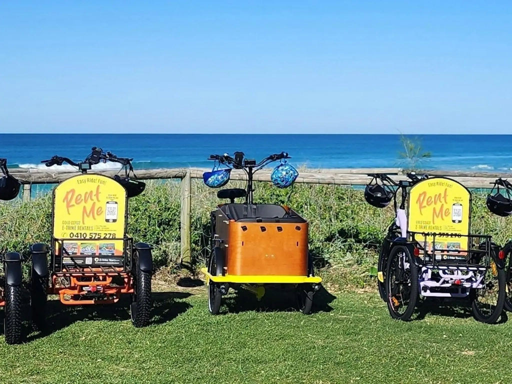 Lineup of E-Trike rentals on the Gold Coast beachfront,   e-bike alternatives for sightseeing.