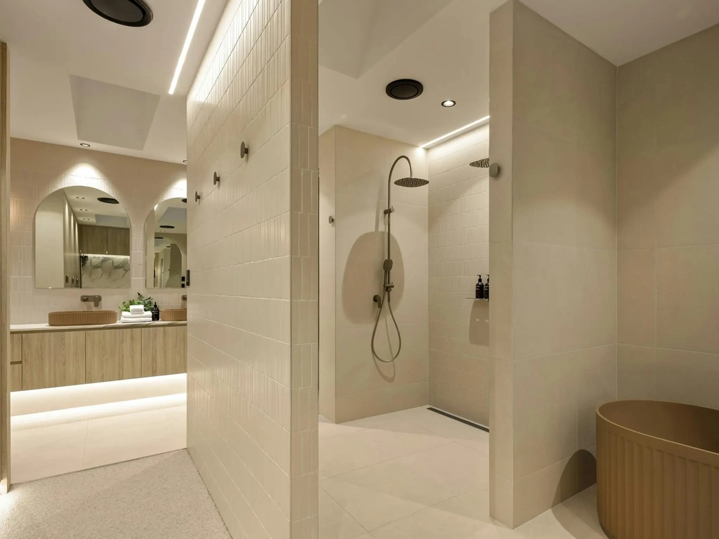 Ensuite bathroom with a walk in shower, freestanding bath and twin basins