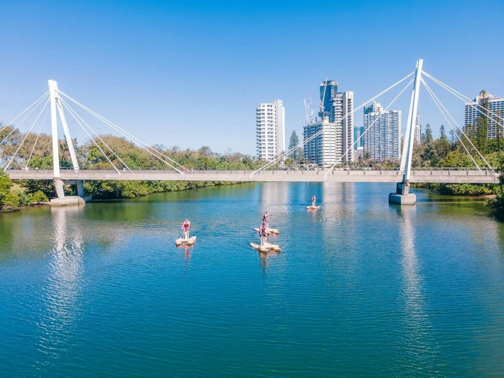 Waterbikes pedalling under Macintosh Island bridge