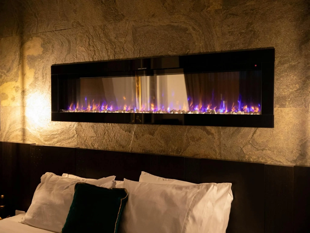 Luxurious modern fireplace above the bedhead